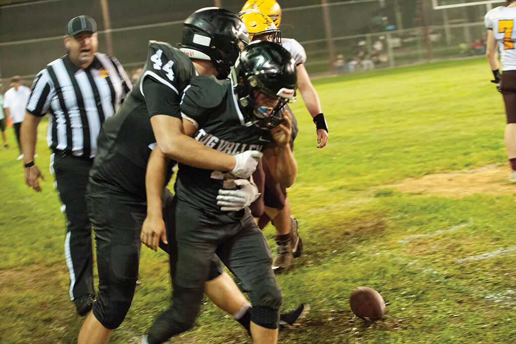 9-10 Ethan Colegrove helping up Tanner Kirk.jpg